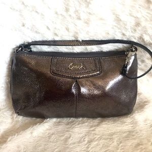 Like new- COACH WRISTLET. Silver. Worw one time to a wedding, no show of wear.